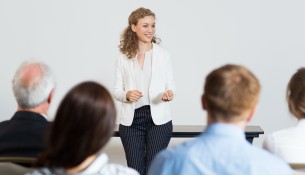Successful Young Businesswoman Holding Speech