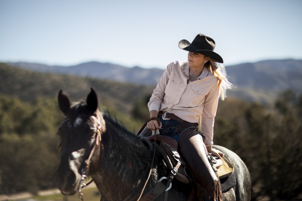 cowboy-silhouette-with-horse-against-warm-light