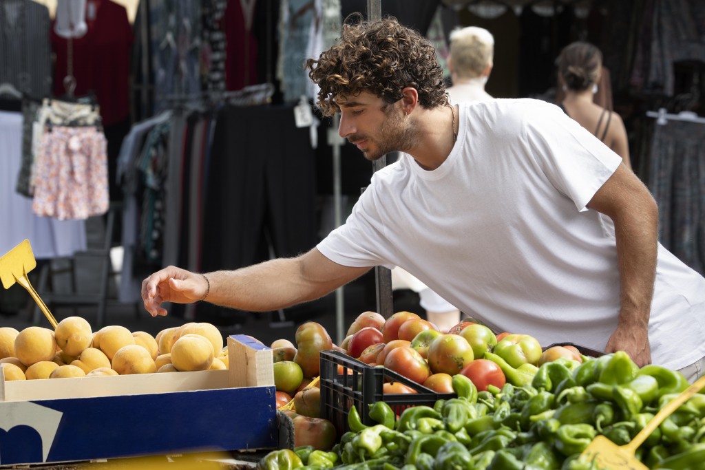 close-up-young-man-food-market