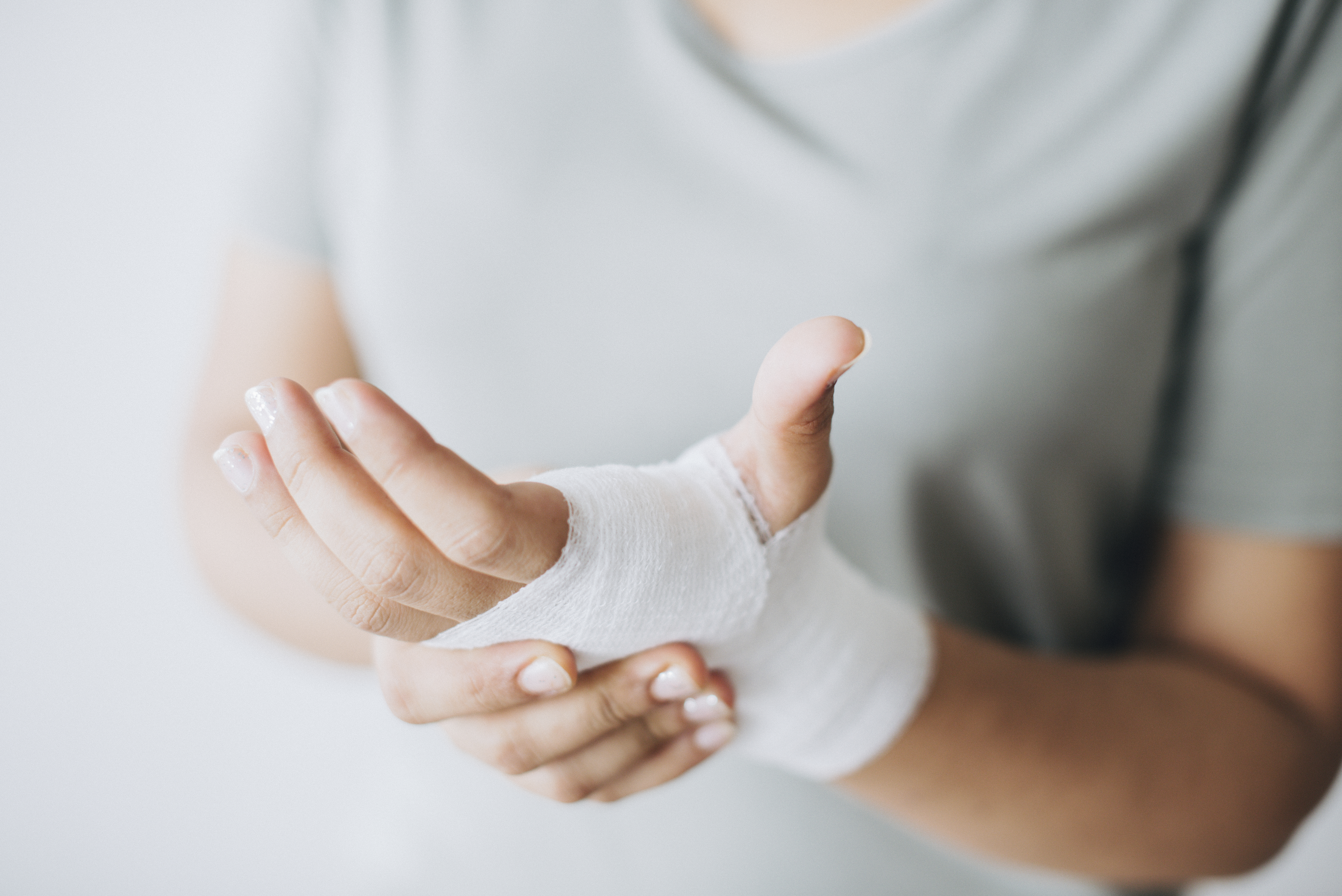 woman-with-gauze-bandage-wrapped-around-her-hand