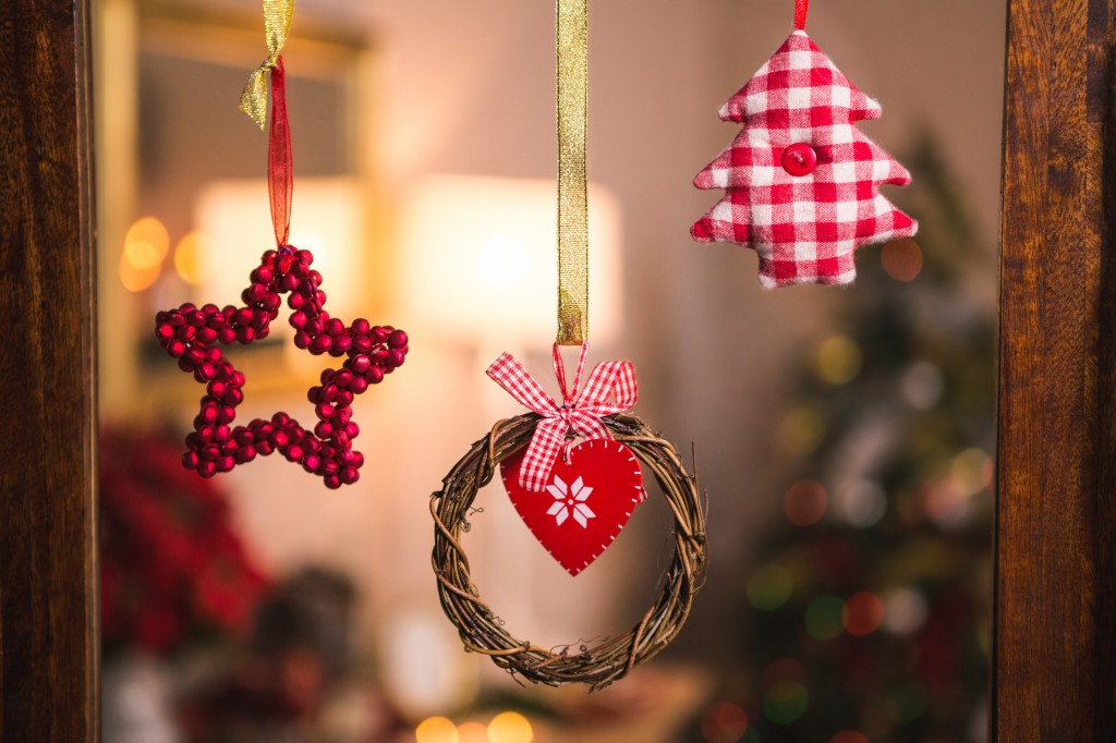 Christmas grapevine wreath with ribbon hanging on window