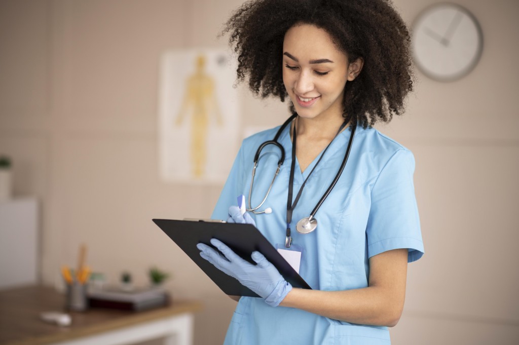 female-doctor-taking-notes-clipboard