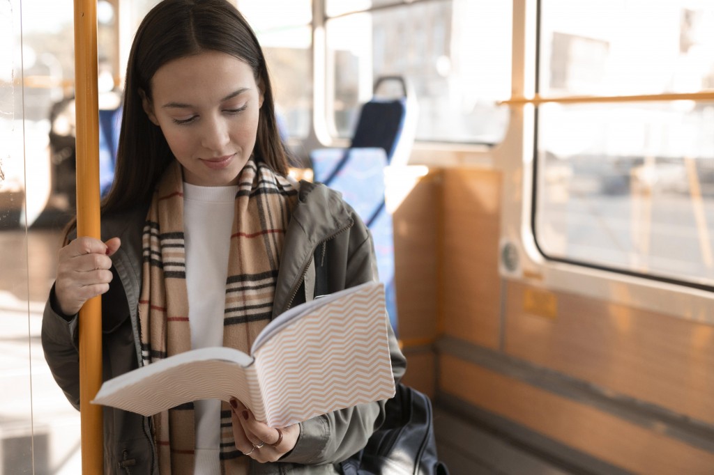 passenger-reading-travelling-by-tram