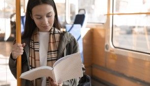 passenger-reading-travelling-by-tram