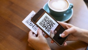 person-scanning-qr-code-cafeteria