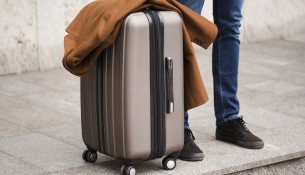 close-up-traveler-with-luggage