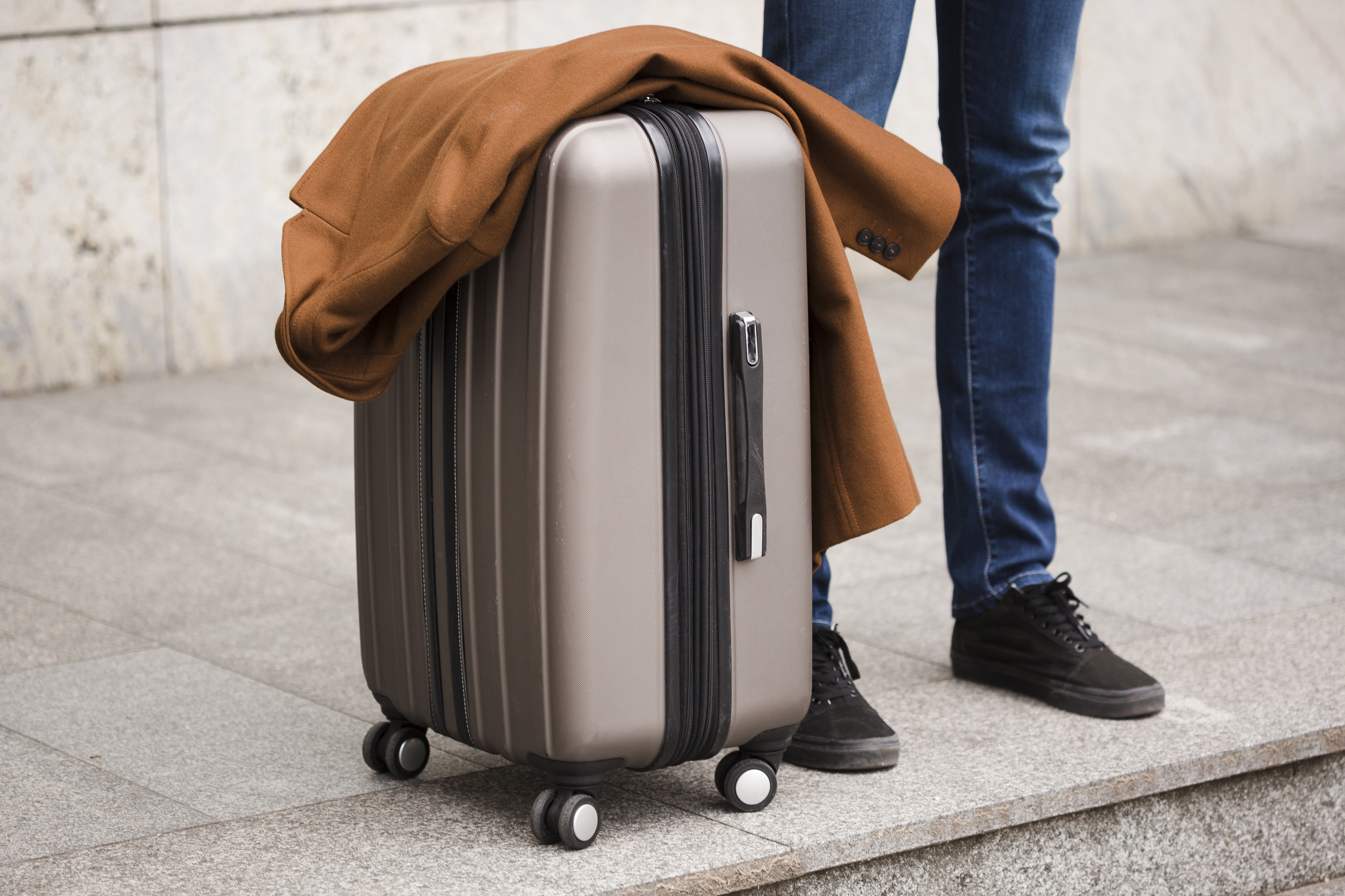 close-up-traveler-with-luggage