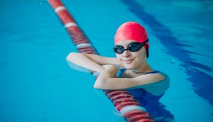 Woman professional swimmer in swimming pool