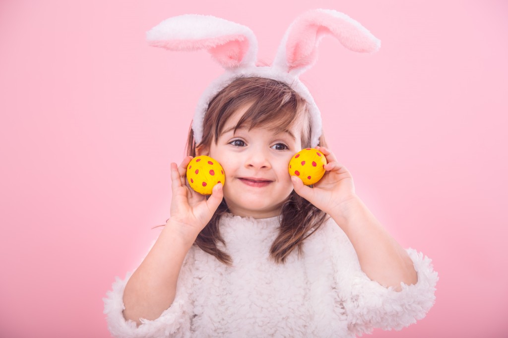 Portrait of a little girl with Bunny ears w Easter eggs