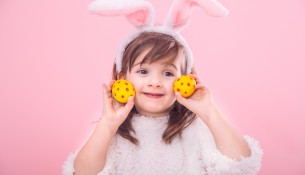 Portrait of a little girl with Bunny ears w Easter eggs
