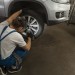 male-mechanic-working-shop-car