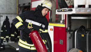 male-firefighter-station-equipped-with-suit-safety-helmet