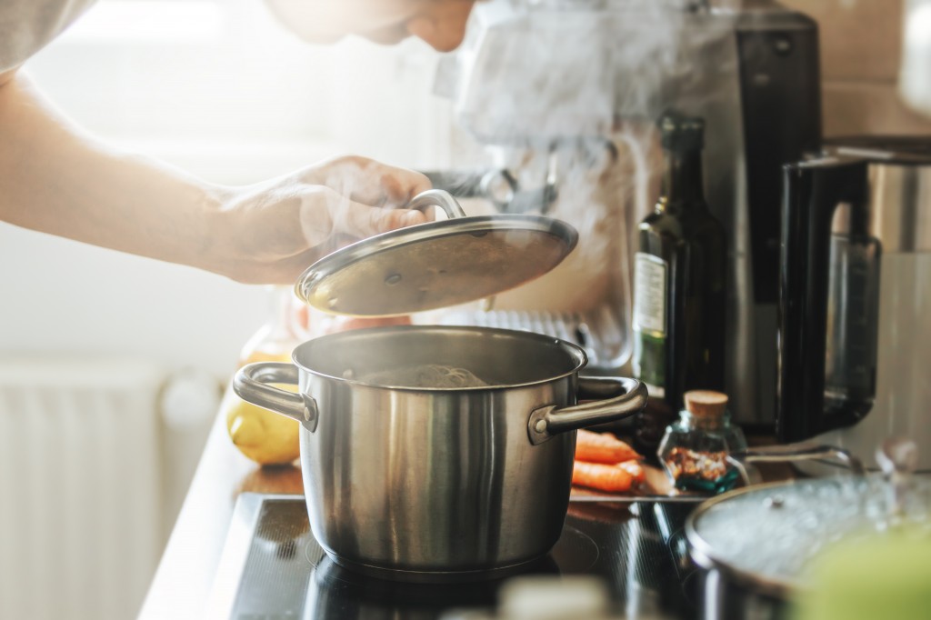 Man cooking fresh food at home