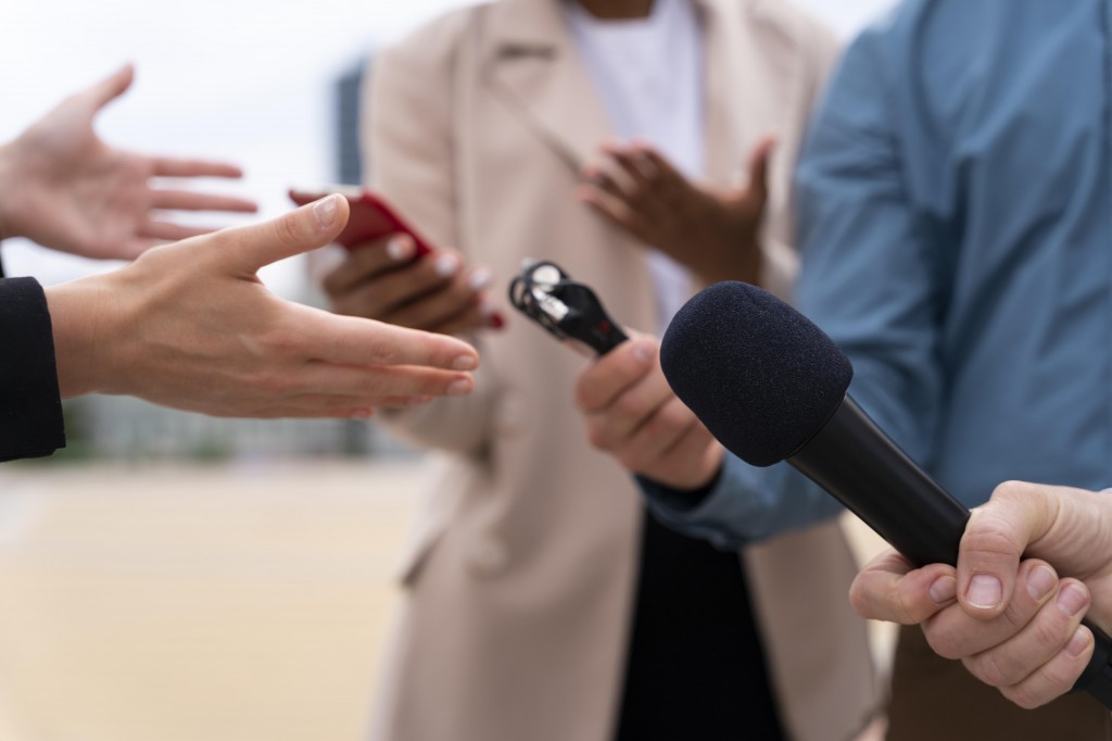 people-taking-interview-outdoors