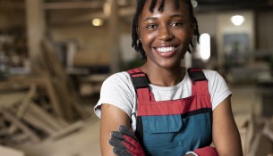 front-view-smiley-woman-holding-crossed-arms