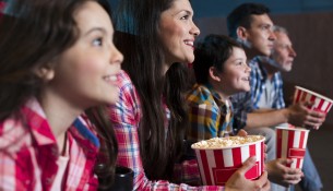 happy-family-sitting-cinema