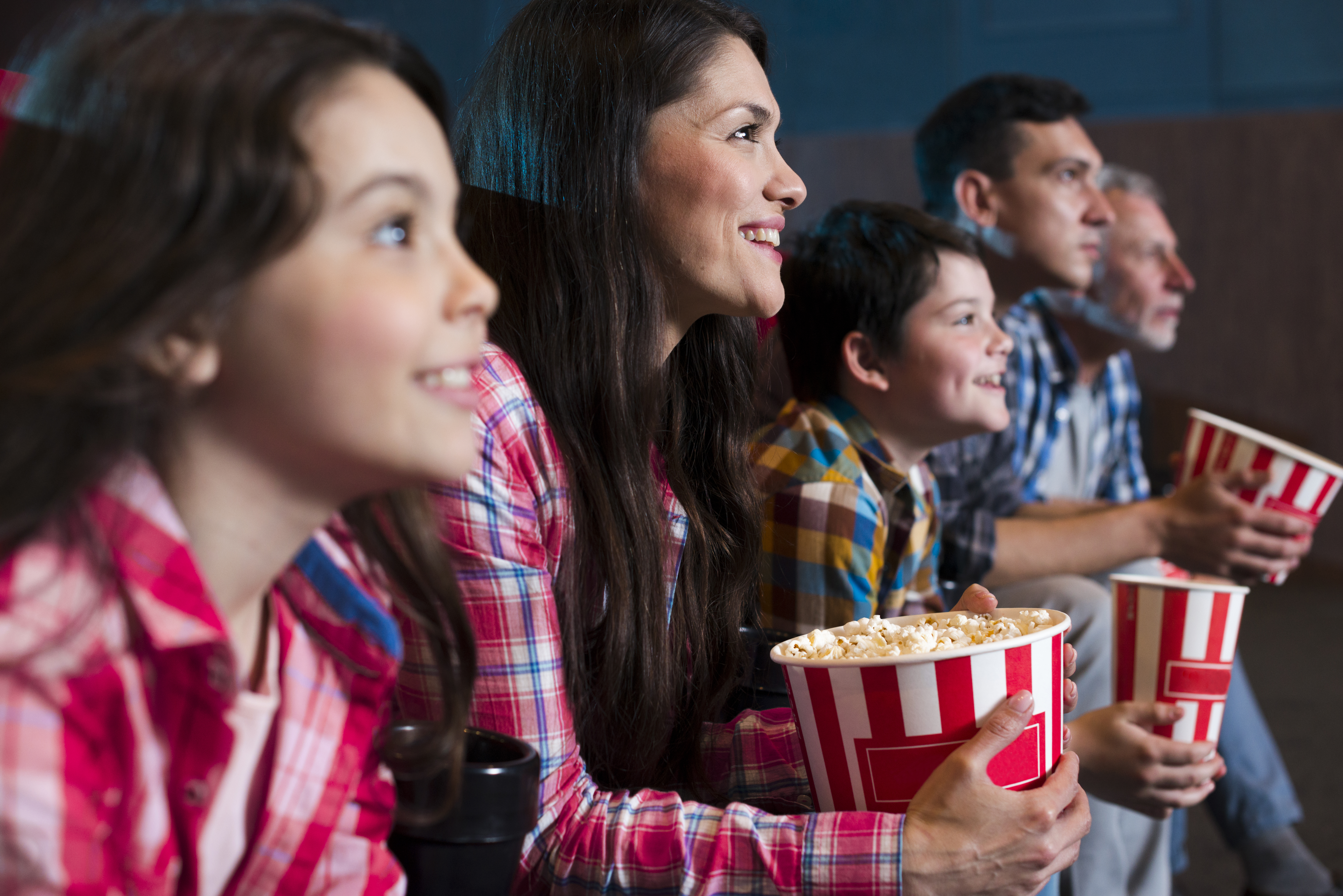 happy-family-sitting-cinema