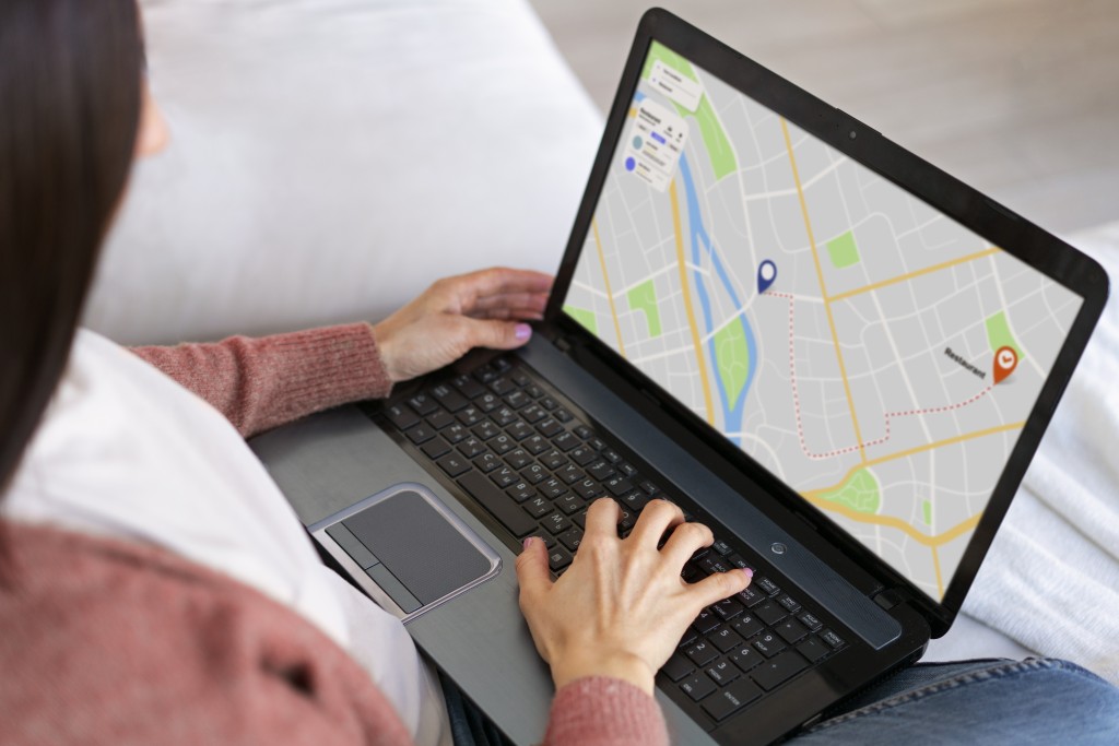 high-angle-woman-holding-laptop