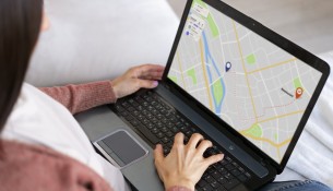 high-angle-woman-holding-laptop