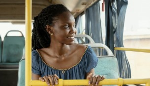 medium-shot-woman-traveling-by-bus