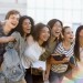 Multiethnic group of young happy students standing outdoors