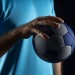 close-up-hand-holding-handball-ball