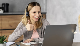 woman-with-headset-working-laptop