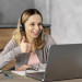 woman-with-headset-working-laptop