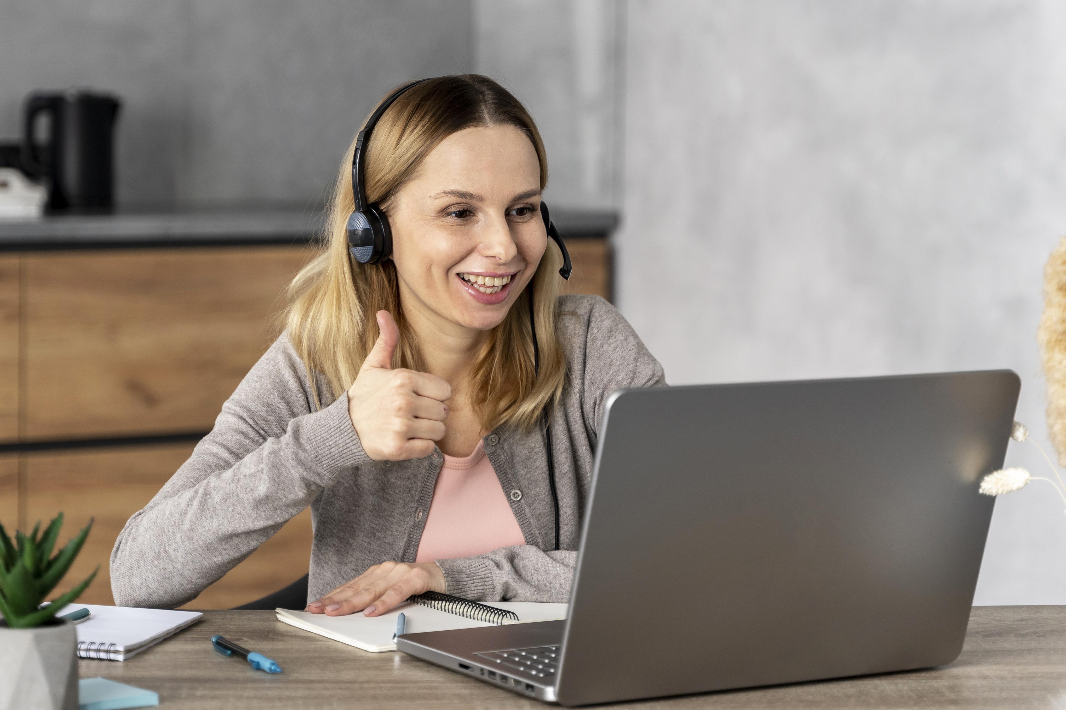 woman-with-headset-working-laptop