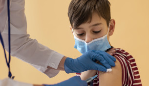 close-up-boy-with-mask-getting-vaccine