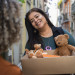 front-view-smiley-woman-holding-box